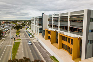 Photograph of Building A façade from an elevated position looking down Fletcher Road 