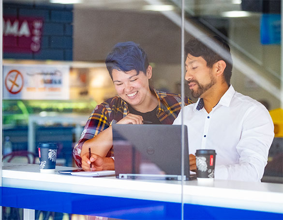 Student having a conversation with a wellbeing support staff.
